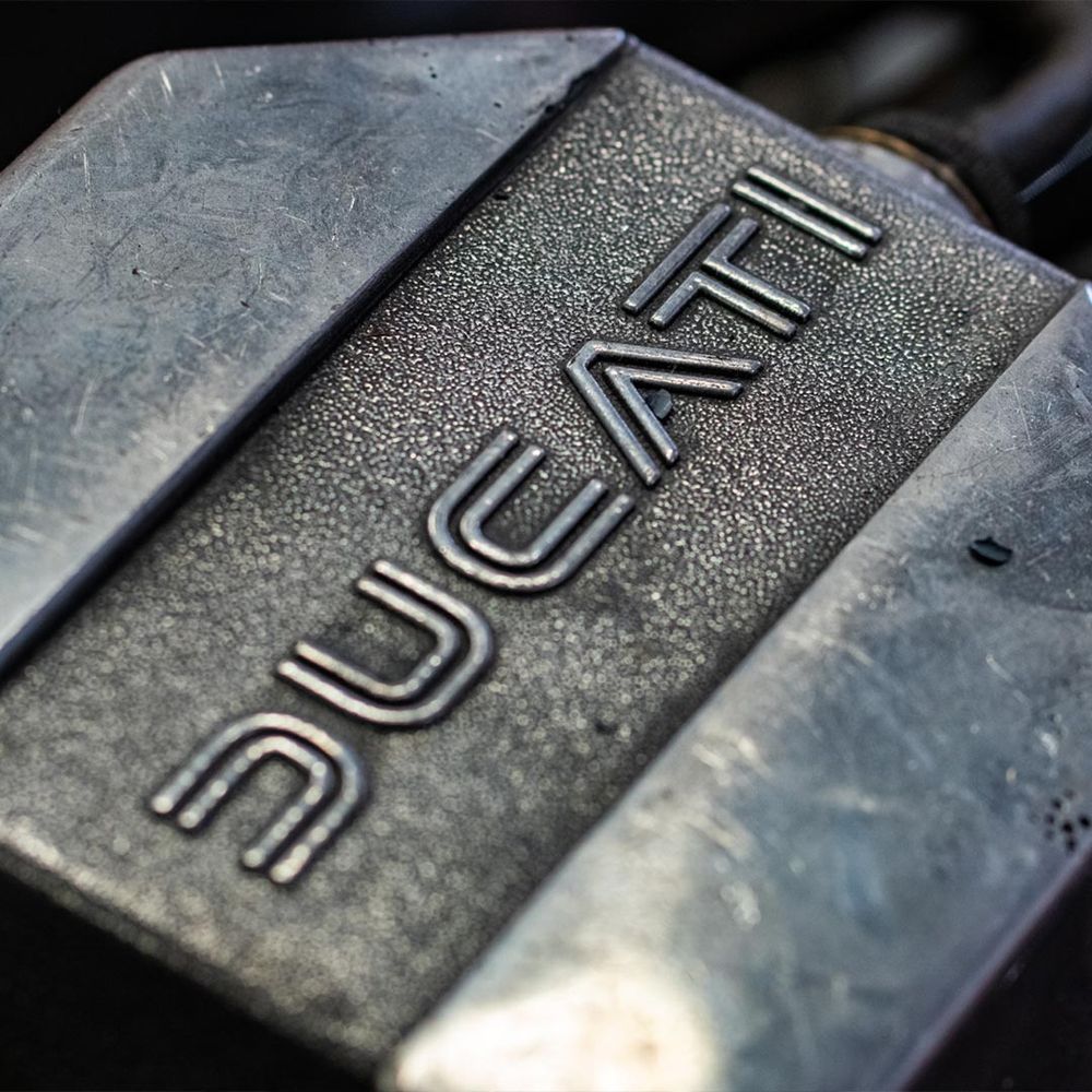 Close-up of a Ducati engine casing logo