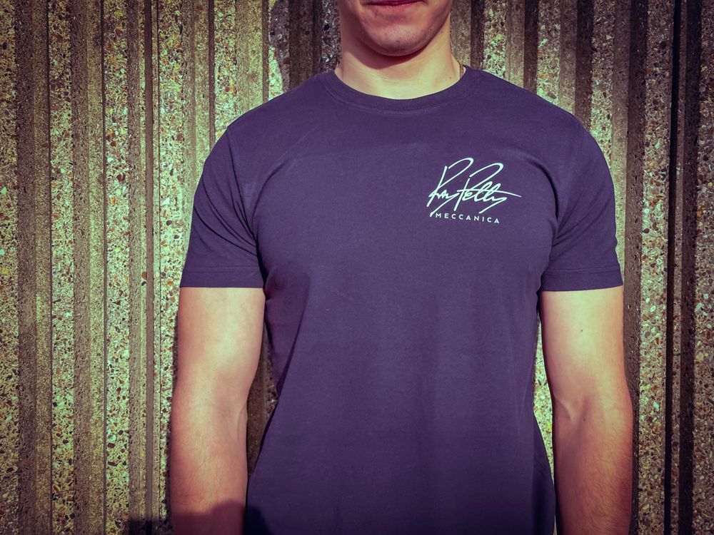 Man wearing the blue Ray Petty Meccanica T-shirt