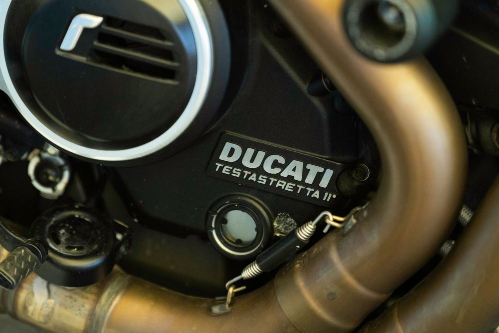 Black Ducati Testastretta 11° engine cover and exhaust header