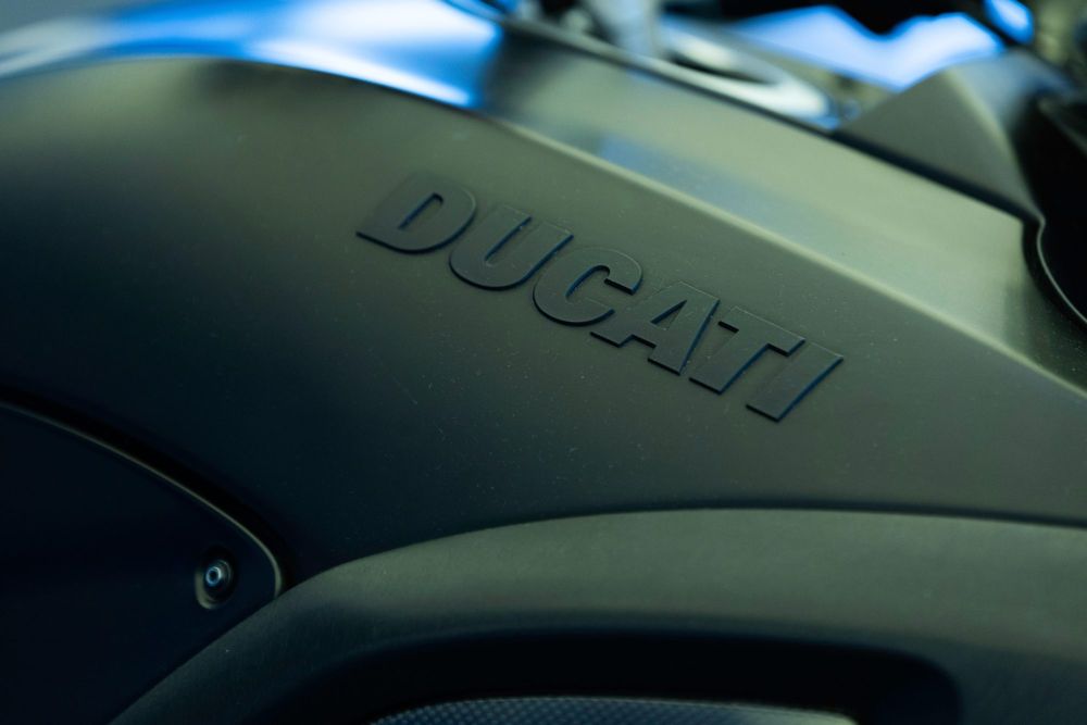 Ducati name moulded into a matt black fuel tank