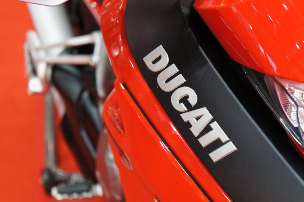 Ducati lettering on red bodywork beside a footpeg