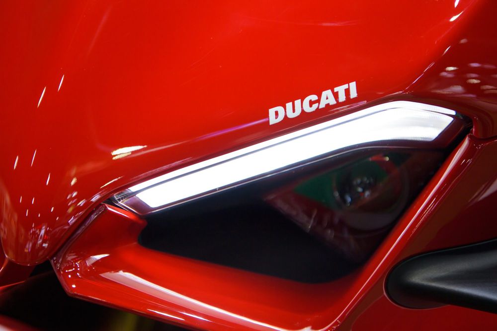 Red Ducati superbike fairing with its LED running light