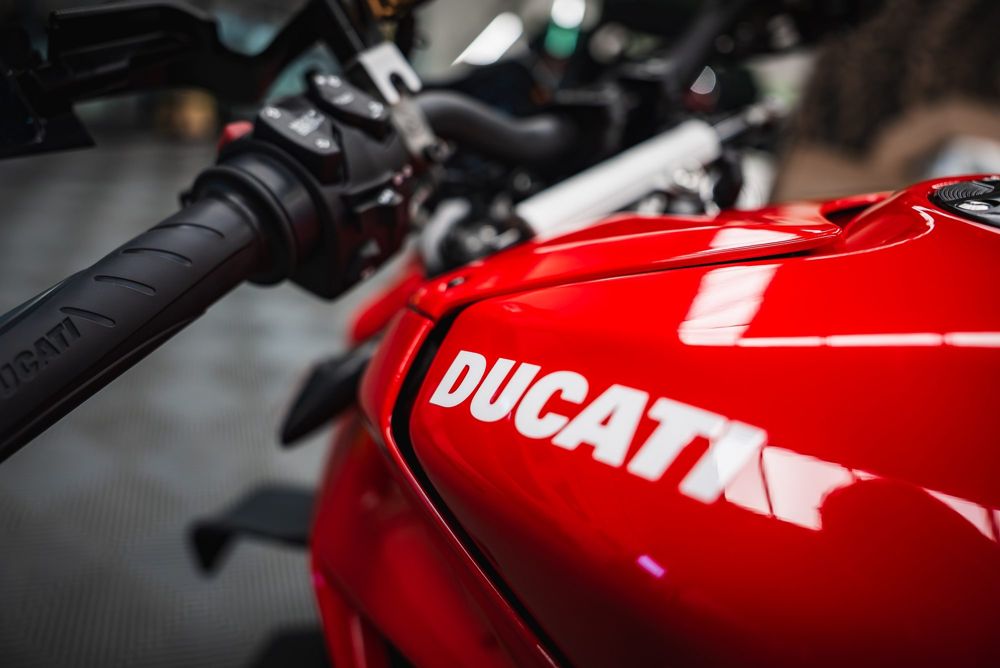Red Ducati fuel tank and handlebar grip