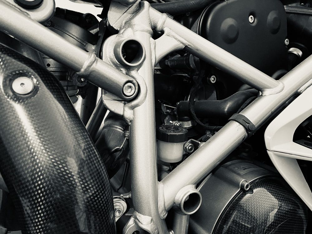 Silver trellis frame and carbon fibre bodywork on a Ducati