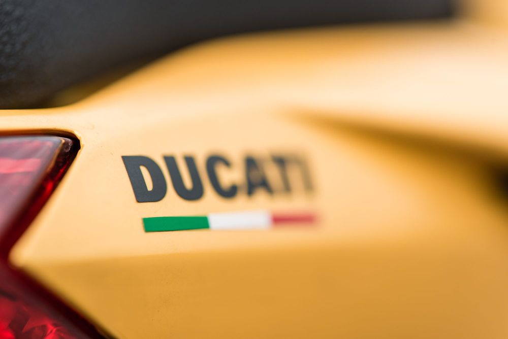 Ducati lettering and Italian flag on yellow bodywork