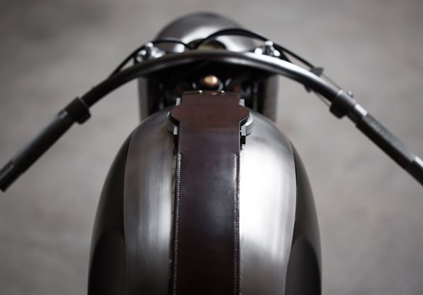 Leather tank strap and clip-on bars, seen from the seat