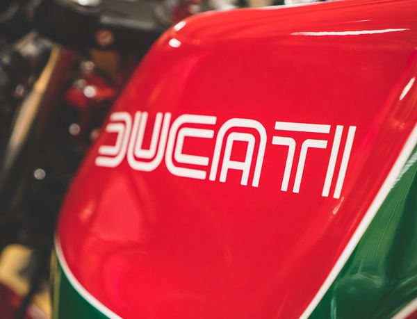 Ducati lettering on a red and green fuel tank