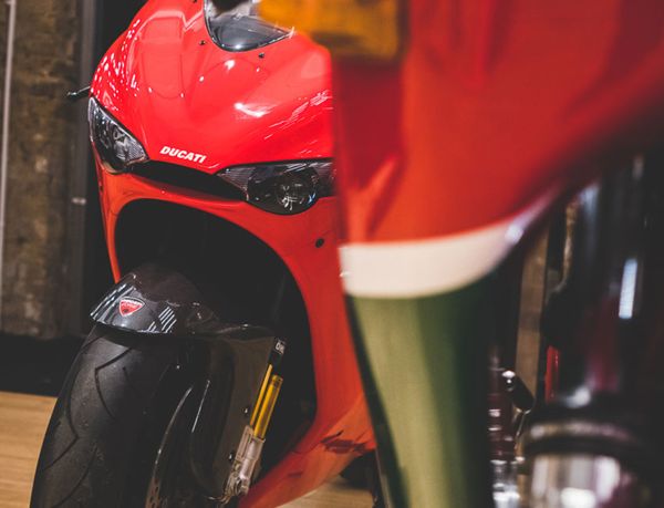 Front of the Desmosedici RR, seen past a classic Ducati's fairing