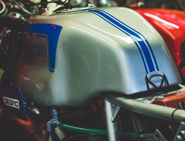 Silver Ducati 900SS tank with blue stripes