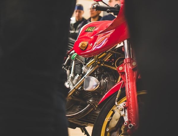 Front of a red classic Ducati at the AGV Dainese store