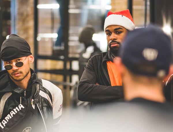 Riders in Christmas hats chatting at the event