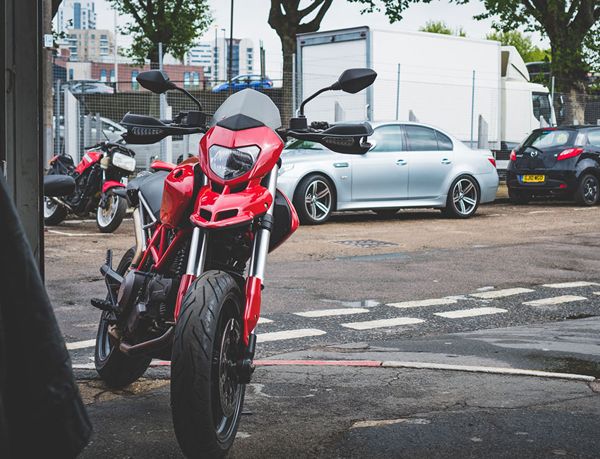 Red Ducati parked outside the workshop on Peterboat Close