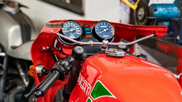 Clocks and red tank of a classic Ducati in red, white and green