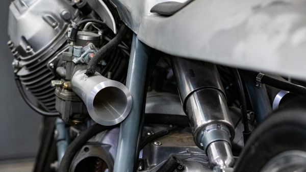 Carburettor and polished alloy tank on a custom Moto Guzzi
