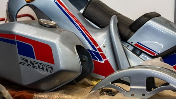 Silver Ducati tank and seat unit with red and blue stripes