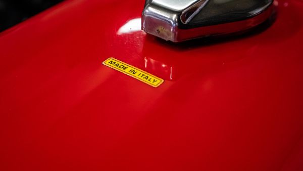 Made in Italy sticker on a red Ducati fuel tank