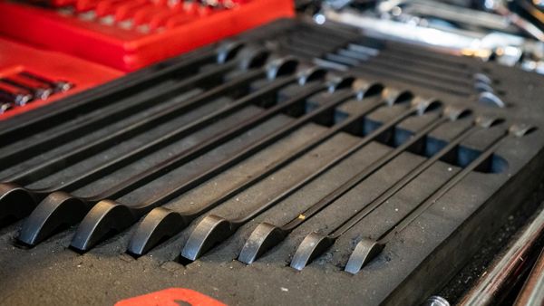 Row of spanners laid out in a tool drawer
