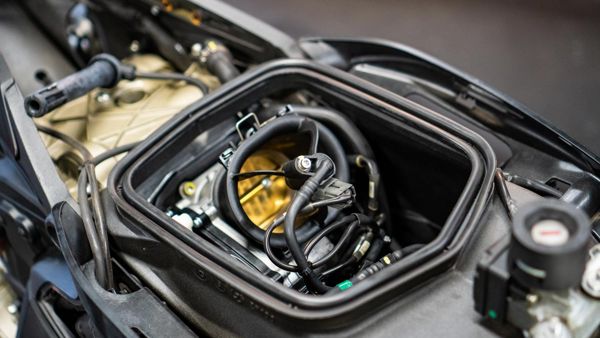Airbox removed to show the throttle bodies of a modern Ducati