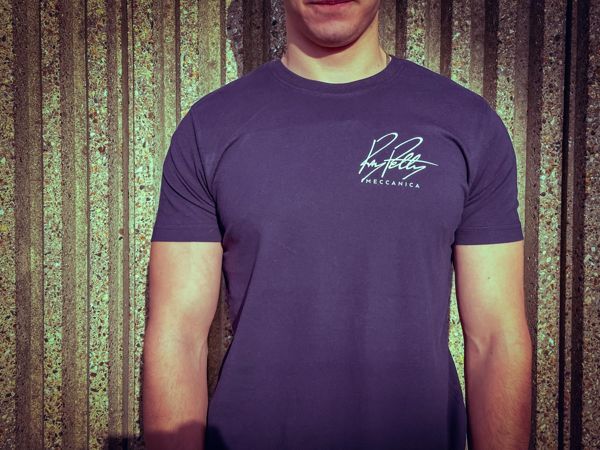 Man wearing the blue Ray Petty Meccanica T-shirt