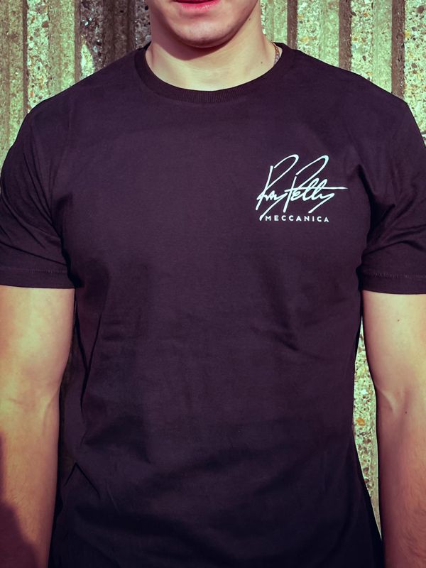 Man wearing the black Ray Petty Meccanica T-shirt