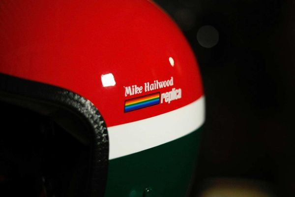 Mike Hailwood Replica lettering painted on a red and green helmet