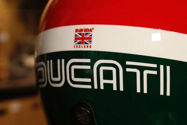 White Ducati lettering on a red, white and green painted helmet