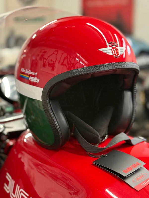 Red, white and green helmet with Mike Hailwood Replica lettering on a Ducati tank