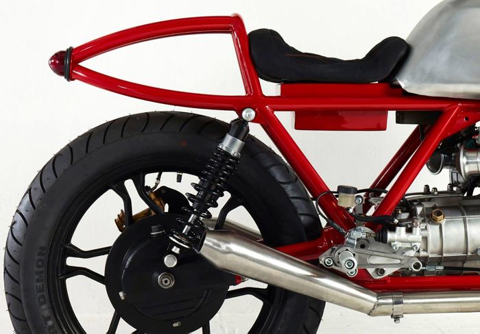 Custom Moto Guzzi with red frame and polished alloy tank, built for Death Machines of London