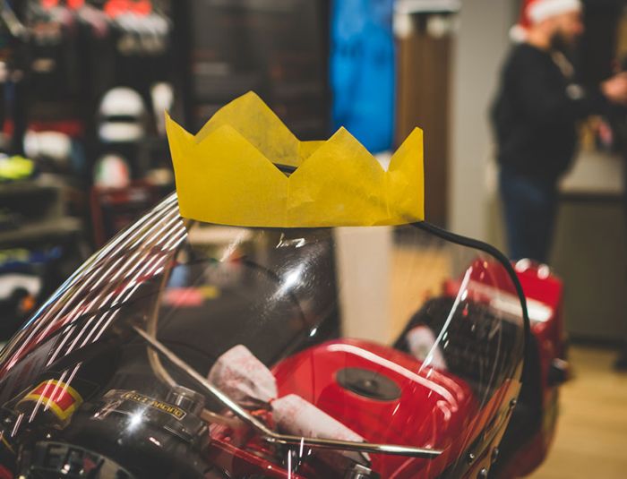 Ducati wearing a paper crown at the AGV Dainese Christmas event
