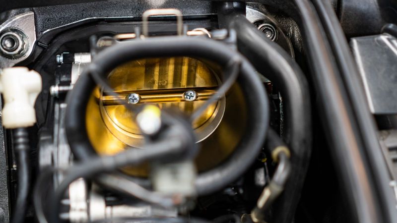 Close-up of a Ducati throttle body during a service