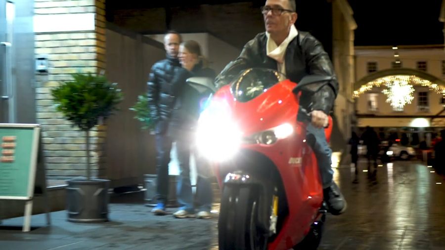 Still from the film: Ray Petty riding the Ducati Desmosedici RR into Greenwich Market